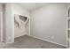 Bedroom featuring carpet, a closet, and access to built in bookshelf space at 10835 W Saddlehorn Rd, Peoria, AZ 85383