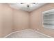 Cozy bedroom featuring neutral walls, carpet, and a window at 10835 W Saddlehorn Rd, Peoria, AZ 85383