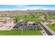 Overhead view of the Sunland Springs Golf Club featuring the course, clubhouse, parking, and the desert landscape at 10960 E Monte Ave # 169, Mesa, AZ 85209