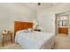 Bedroom with ceiling fan, a sliding closet door, and an ensuite bathroom at 10960 E Monte Ave # 169, Mesa, AZ 85209