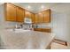 Kitchen with oak cabinets and granite countertops at 10960 E Monte Ave # 169, Mesa, AZ 85209