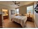 Cozy main bedroom with two windows, ceiling fan and en-suite bathroom at 10960 E Monte Ave # 169, Mesa, AZ 85209