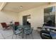 Relaxing covered patio with a dining set and a grill for outdoor enjoyment and perfect for al fresco meals at 10960 E Monte Ave # 169, Mesa, AZ 85209