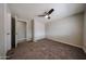 Bedroom featuring neutral walls, carpeted floor, ceiling fan, and closet at 11275 N 99Th Ave # 170, Peoria, AZ 85345