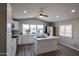 Bright kitchen featuring white cabinets, stainless steel appliances, kitchen island, and lots of natural light at 11275 N 99Th Ave # 170, Peoria, AZ 85345