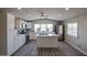 Bright kitchen featuring white cabinets, stainless steel appliances, quartz countertops, and lots of natural light at 11275 N 99Th Ave # 170, Peoria, AZ 85345