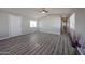 Inviting living room with gray flooring and updated ceiling fan at 11275 N 99Th Ave # 170, Peoria, AZ 85345