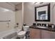 Bathroom with shower-tub combination, modern fixtures, and neutral color palette at 11540 W Sonoran Ct, Surprise, AZ 85378