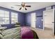 Comfortable bedroom featuring a ceiling fan, carpet flooring, and a double-hung window at 11737 W Robin Dr, Sun City, AZ 85373