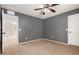 Bedroom featuring carpet flooring and a ceiling fan, perfect for a relaxing atmosphere at 11737 W Robin Dr, Sun City, AZ 85373