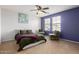 Serene bedroom featuring modern decor, plenty of natural light, and comfortable seating area at 11737 W Robin Dr, Sun City, AZ 85373