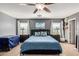 Inviting bedroom with large windows, ceiling fan, and modern decor for a relaxing retreat at 11737 W Robin Dr, Sun City, AZ 85373