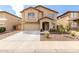 Inviting two-story home with a well-maintained front yard and a two-car garage at 11737 W Robin Dr, Sun City, AZ 85373