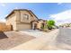 Charming two-story home with a well-kept front yard and a convenient two-car garage at 11737 W Robin Dr, Sun City, AZ 85373