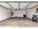 Spacious garage with a water heater, central pneumatic compressor, and ample storage space at 11737 W Robin Dr, Sun City, AZ 85373