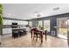 Eat-in kitchen with white cabinets, dark countertops, and seating for four at 11737 W Robin Dr, Sun City, AZ 85373