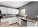 Kitchen with white cabinets, stainless steel appliances and lots of counter space at 11737 W Robin Dr, Sun City, AZ 85373