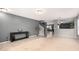Open-concept living room showcasing neutral colors, carpet and tile flooring, and staircase at 11737 W Robin Dr, Sun City, AZ 85373