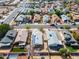 This aerial view showcases a serene neighborhood with diverse homes and green spaces at 11815 N 75Th Ln, Peoria, AZ 85345