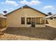 Back exterior featuring a screened-in porch and gravel landscaping at 11815 N 75Th Ln, Peoria, AZ 85345