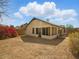 Back exterior featuring a screened-in porch, and gravel landscaping with privacy fence at 11815 N 75Th Ln, Peoria, AZ 85345