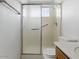 Bathroom featuring toilet, glass door walk-in shower and grab bars for safety at 11815 N 75Th Ln, Peoria, AZ 85345