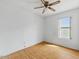 Bedroom with a ceiling fan, light hardwood floors and a window at 11815 N 75Th Ln, Peoria, AZ 85345