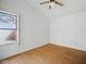 Bright bedroom with a large window and hardwood floors at 11815 N 75Th Ln, Peoria, AZ 85345