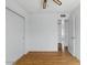 Bedroom features sliding closet doors, light hardwood floors and neutral walls at 11815 N 75Th Ln, Peoria, AZ 85345