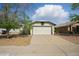 Charming single-story home featuring a neutral color scheme, two-car garage and mature trees in a well-maintained landscape at 11815 N 75Th Ln, Peoria, AZ 85345