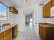 Bright kitchen featuring wood cabinets, tile flooring, and ample natural light, creating a functional space for cooking at 11815 N 75Th Ln, Peoria, AZ 85345