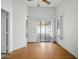Spacious living room with hardwood floors, slider, and abundant natural light at 11815 N 75Th Ln, Peoria, AZ 85345