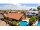 Desert home with tile roof, desert landscaping, pool, and covered patio from an aerial view at 12436 S 38Th Pl, Phoenix, AZ 85044