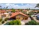 Desert home featuring tile roof, awnings, swimming pool, and low-maintenance landscaping from above at 12436 S 38Th Pl, Phoenix, AZ 85044