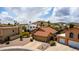 Aerial view of a home with a red tile roof, desert landscaping, and a two car garage at 12436 S 38Th Pl, Phoenix, AZ 85044