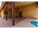 Extended covered patio with fan overlooking sparkling private pool at 12436 S 38Th Pl, Phoenix, AZ 85044