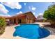 Resort-style backyard with pool, mature trees, and space for entertaining at 12436 S 38Th Pl, Phoenix, AZ 85044