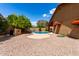 Desert backyard features a refreshing pool and a spacious, low-maintenance landscape at 12436 S 38Th Pl, Phoenix, AZ 85044
