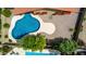 Aerial view highlighting a private backyard pool with clean lines, modern finishes, and desert landscaping at 12436 S 38Th Pl, Phoenix, AZ 85044