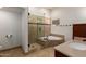 Beautiful bathroom featuring a seamless glass shower, soaking tub, and neutral colors at 12436 S 38Th Pl, Phoenix, AZ 85044