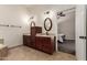 Lovely bathroom with double sinks, vanity, and a doorway leading to the main bedroom at 12436 S 38Th Pl, Phoenix, AZ 85044
