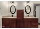 Bright bathroom features dual sinks with granite counters and oval mirrors for a modern look at 12436 S 38Th Pl, Phoenix, AZ 85044