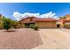 Charming single-story home featuring a red tile roof, neutral stucco, and low-maintenance landscaping at 12436 S 38Th Pl, Phoenix, AZ 85044