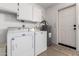 Functional laundry area with washer, dryer, and cabinets for storage at 12436 S 38Th Pl, Phoenix, AZ 85044