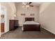 Spacious main bedroom with vaulted ceiling, fan, plush carpet, and plenty of natural light at 12436 S 38Th Pl, Phoenix, AZ 85044
