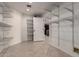 Large walk-in pantry features adjustable metal shelving for optimal storage and organization at 12436 S 38Th Pl, Phoenix, AZ 85044