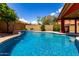 Sparkling pool with a tile border and clear blue water, ready for a refreshing swim at 12436 S 38Th Pl, Phoenix, AZ 85044