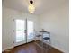 Dining area with view of the backyard through the sliding glass doors with two barstools at 1302 E Maryland Ave # 15, Phoenix, AZ 85014