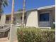 Condo building exterior shows front-facing units with stairs and green hedges in front at 1302 E Maryland Ave # 15, Phoenix, AZ 85014