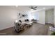 Comfortable living room has lots of natural light with a soft couch and colorful chair at 1302 E Maryland Ave # 15, Phoenix, AZ 85014